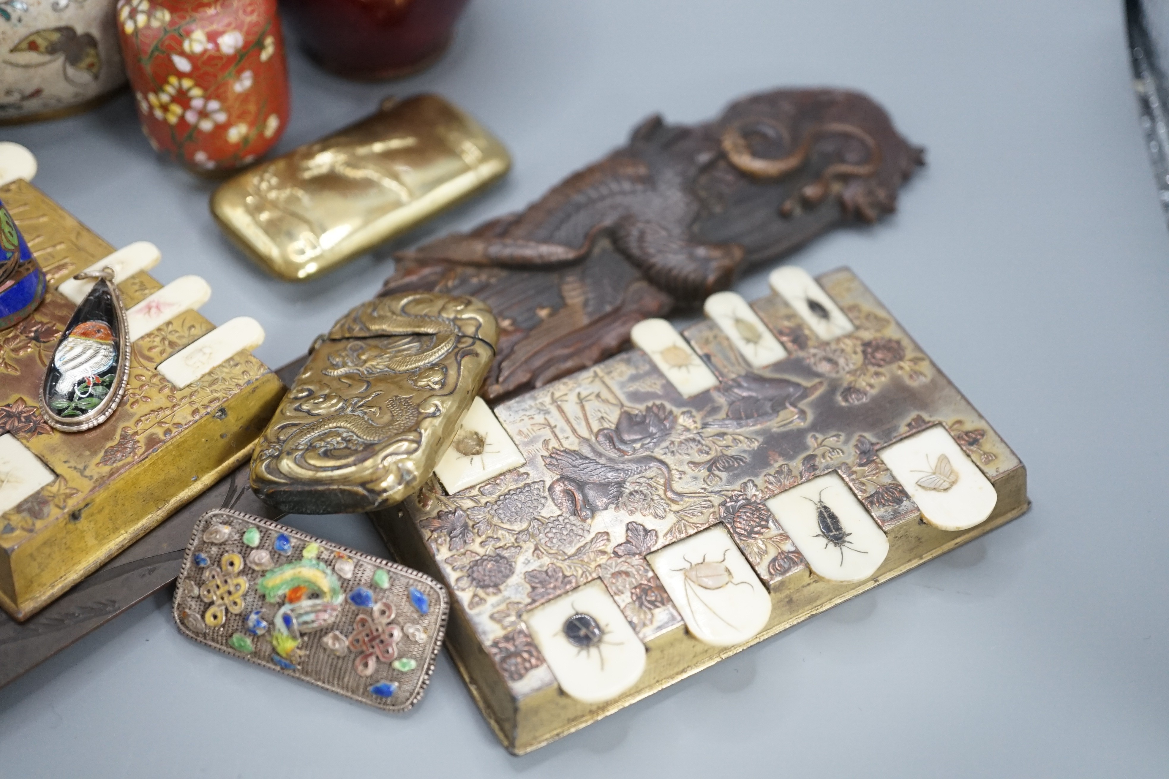 A group of Chinese and Japanese miniature cloisonne enamel vases, 6cm - 12.5cm, a Japanese mixed metal paper knife or page turner and a pair of Japanese antimony and celluloid bezique markers